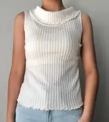 white sleeveless ruffle turtleneck inspired shirt