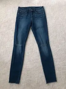 Medium Wash Skinny With Distressed Ankle Hem