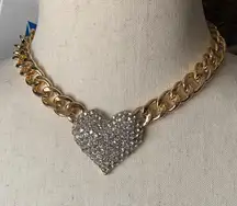 Beautiful gold color chunky necklace with a large heart covered in rhinestones, 15 inch chain with a 3 inch extender, excellent condition