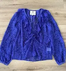 the jetset diaries printed long sleeve sheer lace up ruffle blouse