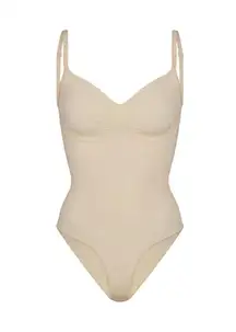 Skims seamless sculpt brief bodysuit shapewear in sand tan color