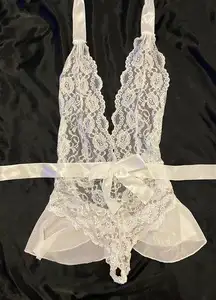 White lace lingerie with peplum skirt and bow sash