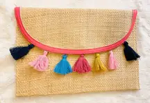 NWOT woven straw clutch with rainbow tassels 