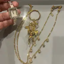 Kirk’s Folly 4 Pieces Watch, Gold Angel Key Chain, a Bangle, Eye Glass Necklace