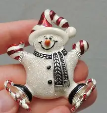 Ice skating candy cane snowman pin
