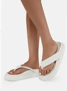 Dolls Kill Low Platform Flip Flop Sandals - White