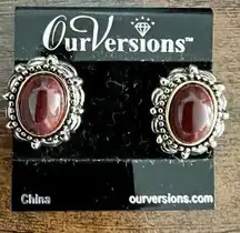 Our Versions Clip-On Earrings with a brown stone and antiques silver setting.