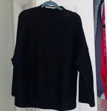 High neck black ribbed sweater with wide sleeves