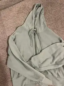 light green/grey zip up