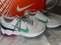 White Nike Renew Run Sneakers