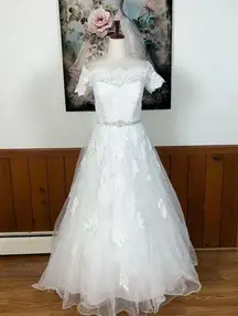 Elegant Jewel by David’s Bridal Off-Shoulder Lace Wedding Gown!