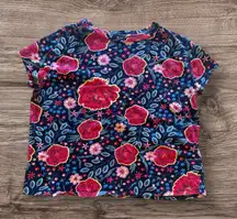 short-sleeved t-shirt with an all-over floral print. The shirt features