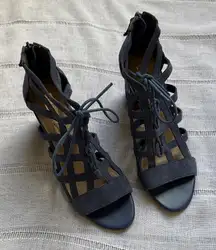 Aubrey Lynn blue suede gladiator-style heels with a tie and zip closure