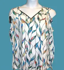 Really cute white cold shoulder long sleeve top with color leaf design. New