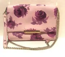 - Kate Spade light pink with flower print purse.