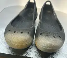 Crocs size 8. Lightly used very cute with hombre. Silver toes sparkle​​