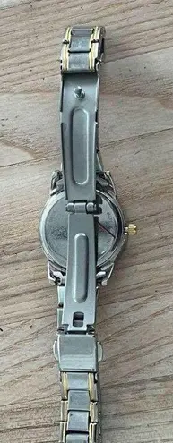 Caravelle by Bulova Ladies Watch Diamonds Black Dial Two Tone Bracelet