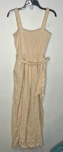 Love Riche cream raw hem jumpsuit open back tie waist women’s size medium trendy