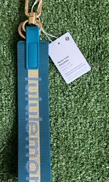 Blue and gold lulu never lost keychain