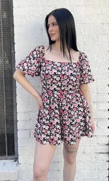 Black and pink floral romper with square neckline and puffy sleeves sz s
