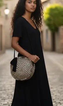 Mudpie brand cute as a button round weaved look casual bag.