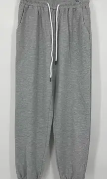 Automet grey sweatpants size med, elastic‎ at waist + ankle. Drawstring. Pockets