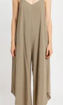 WASHED WOVEN SLOUCHY FITTED JUMPSUIT WITH CAMI STRAP. MADE IN USA