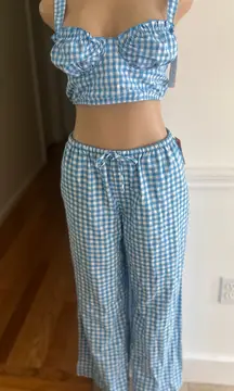 Stylish blue gingham two-piece set featuring a crop top and wide-leg pants.