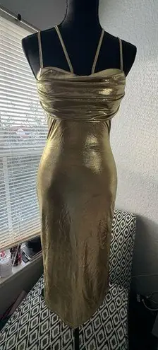 Gold fitted dress with elegant design and double straps.