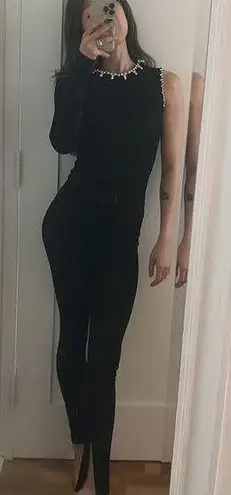 Area black asymmetrical jumpsuit with crystal embellishment