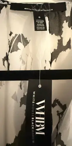 White House | Black Market Embrace the season with this floral maxi dress in classic black and white. The blouson sleeves and lightweight georgette fabric add to its feminine style. A printed slip lining hits at the knee, leaving a sheer skirt flowing to the hemline. Elastic at the wrists and waist ensure a great fit. thumbnail 7