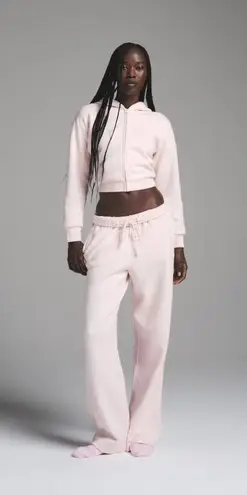 SKIMS Cotton Fleece Shrunken Zip Up Hoodie in Barely Pink, Size Medium