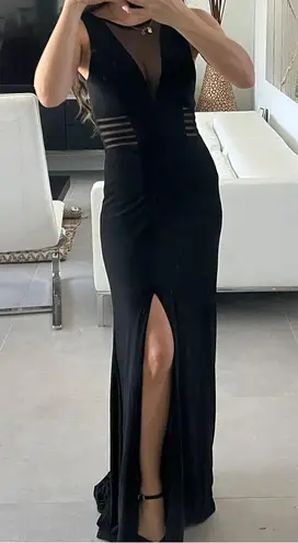 Women size small long black dress with small train bust and waist mesh detail