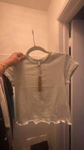 SKIMS Ivory DROP NEEDLE POINTELLE BABY TEE