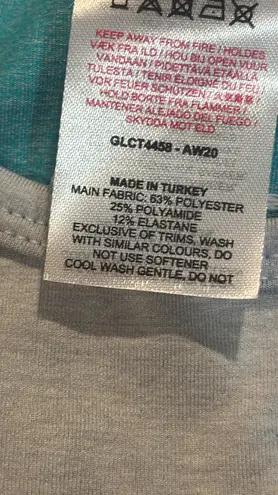   Women's Teal and Gray Long Sleeve Crop Top Size Small . Stylish long sleeve crop top by Gymshark. Features a sleek teal and gray design. Perfect for workouts.. NWT  thumbnail 10