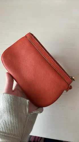 Calvin Klein leather orange wristlet with gold hardware