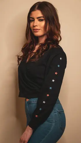 Le lis Embellished Stars Long Sleeve Faux Wrap V-Neck Crop Sweatshirt in Black