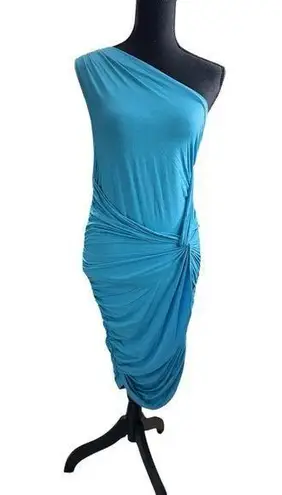 Tart Asymmetrical dress made from a vibrant blue stretch fabric. Its one-shoulder