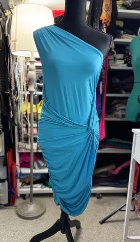 Tart Asymmetrical dress made from a vibrant blue stretch fabric. Its one-shoulder