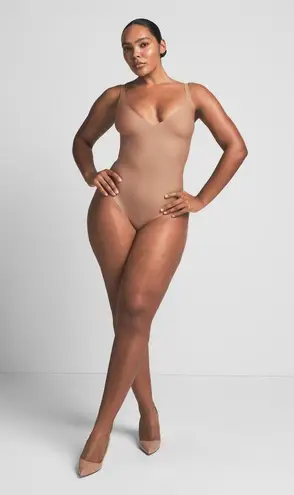 SKIMS Body Unlined Plunge Thong Bodysuit in Sienna, Size Small