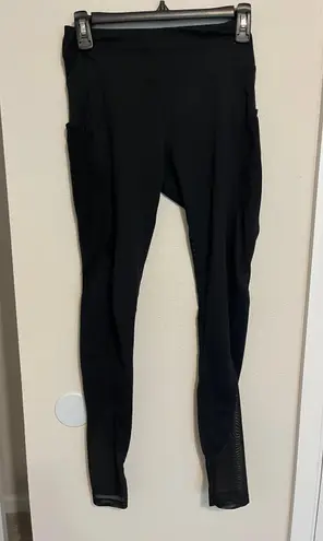 Gymshark black leggings with mesh down sides and pockets