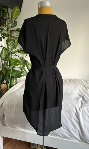 Black blouse like short sleeve high low belted dress