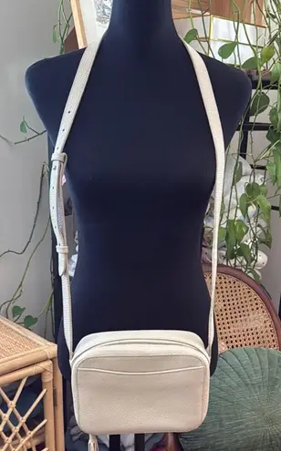 Cuyana Cream Pebbled Leather Tassel Zip Crossbody Camera Bag