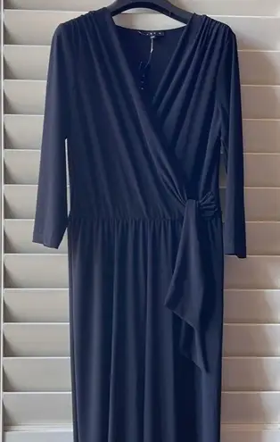 Tiana B Jumpsuit PL Tania B,  Wrap Bodice, a tie at the waist, stretch, 3/4 sleeves, wide leg, 57” length. 17” shoulder to waist, 40” waist to length. New with tag. By Tanya B.  - Image 1