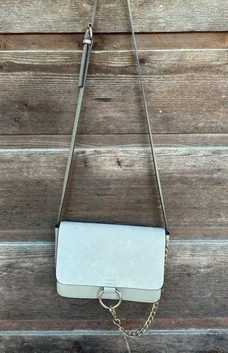 Gray suede Crossbody purse with gold loop and chain details - Image 1
