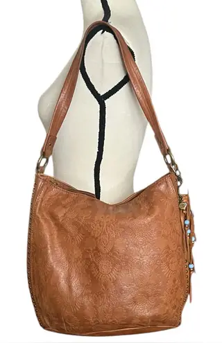 The Sac Embossed Floral Front Leather Shoulder Handbag with Charms. Brown