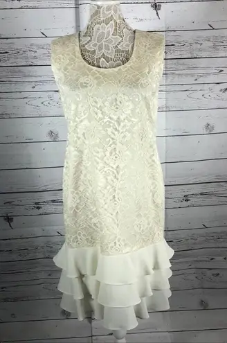 Leslie Fay  sleeveless 
Beautiful lace dress with layered ruffles on the end.