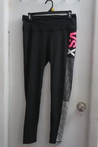 Victoria's Secret VSX sport knockout tight leggings in black, white and pink size medium.
