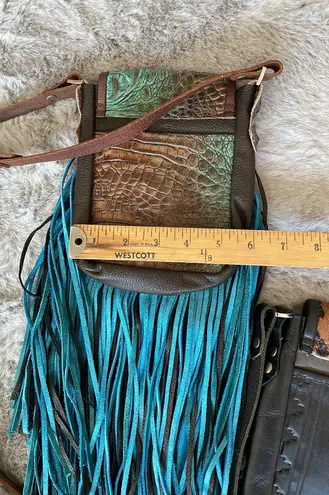 Deep brown and golden browns are stunning on this leather crossbody purse.