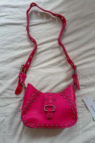 Urban Outfitters hot pink studded shoulder bag.